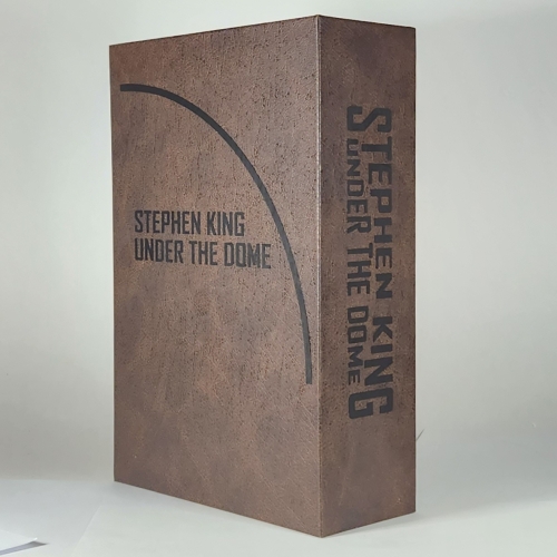 Slipcase design for Stephen King's UNDER THE DOME with black graphics.